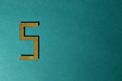 Number five against a teal background.