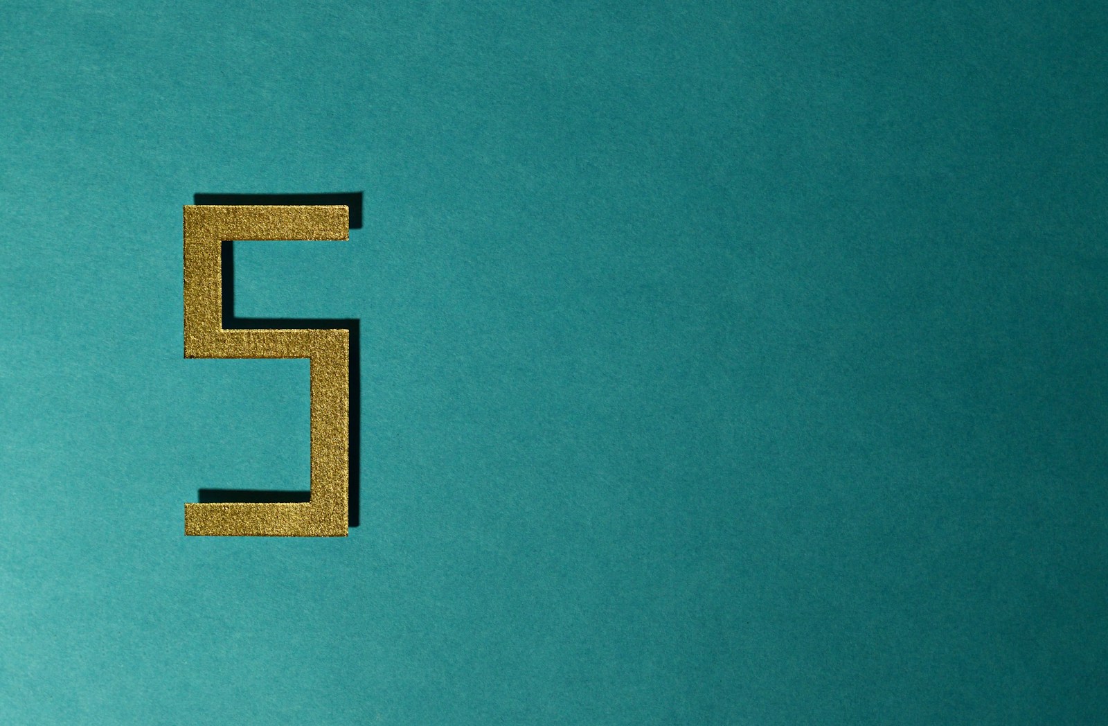 Number five against a teal background.
