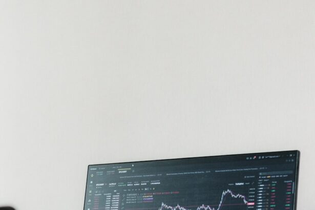 a computer monitor sitting on top of a wooden desk