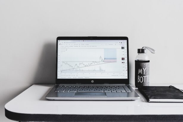 a laptop computer sitting on top of a white desk
