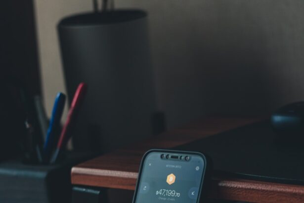 a cell phone sitting on top of a wooden desk