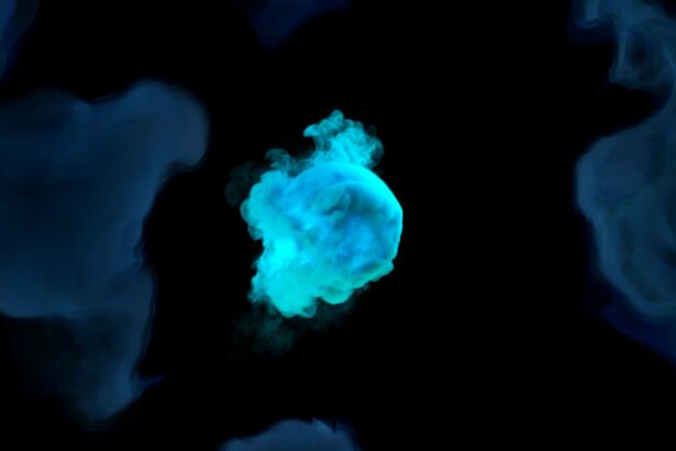 A black background with blue and green smoke