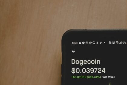 black iphone on brown wooden table