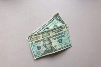 three assorted-denomination U.S. dollar banknotes