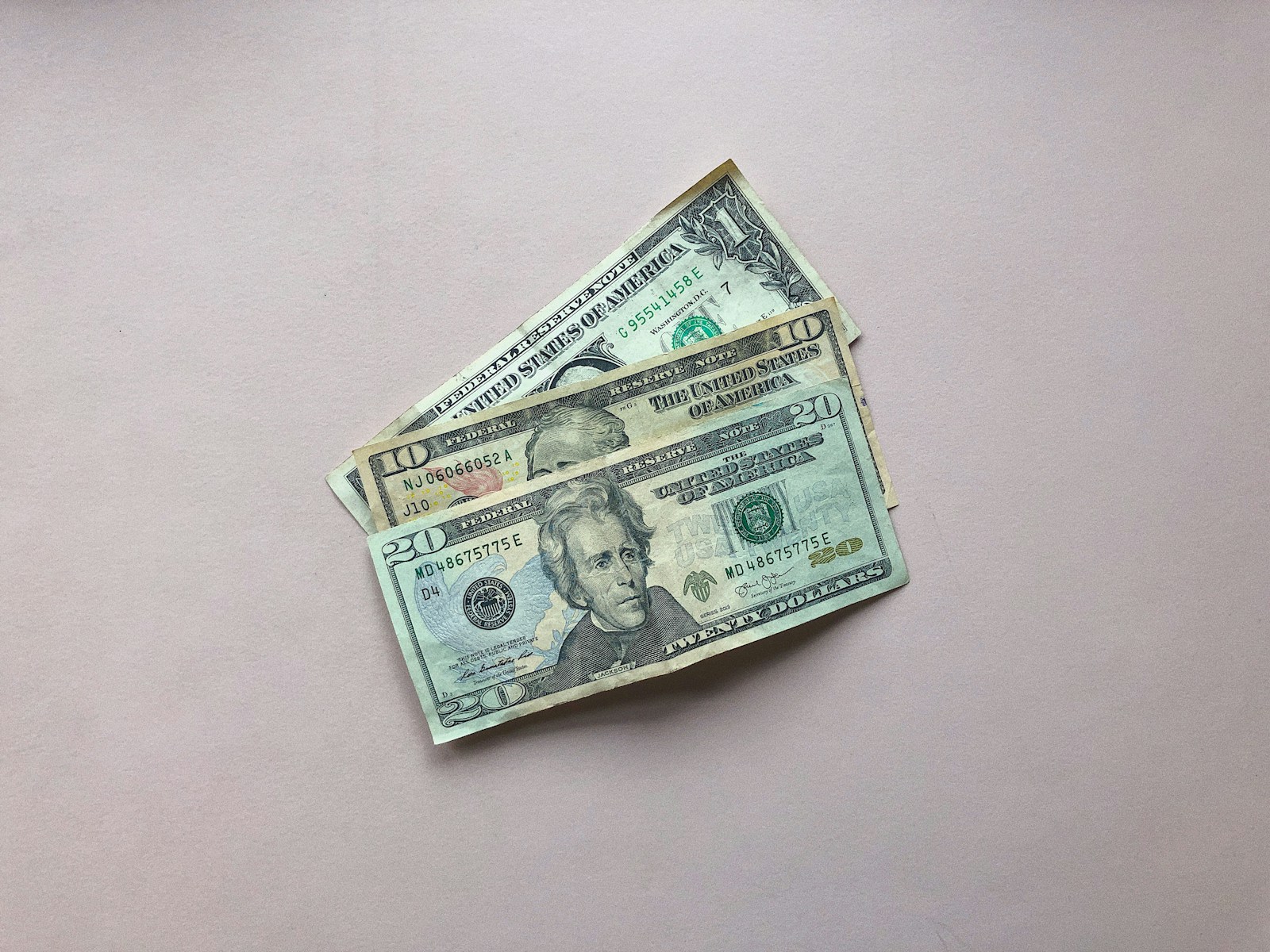 three assorted-denomination U.S. dollar banknotes