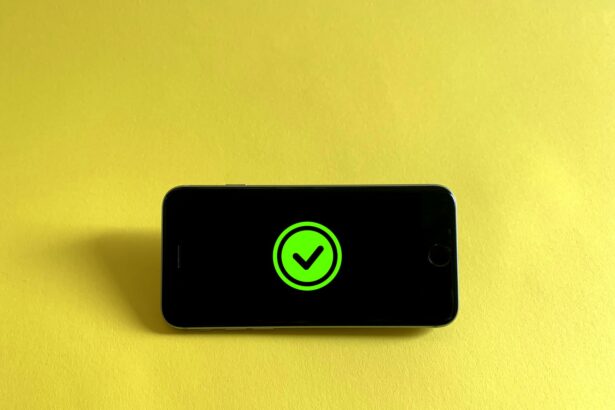 black iphone 5 on white textile